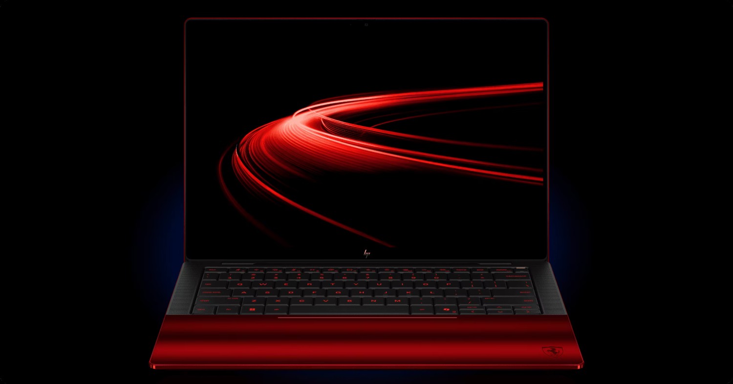 1000040780 Red gaming laptop with black keyboard and red backlit keys, shown on a dark background with red light-trail graphics on the screen.